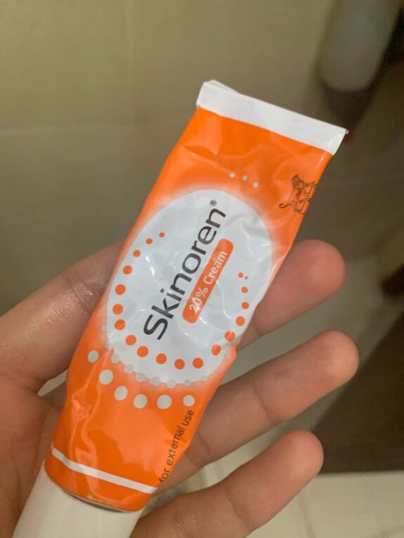 Skinoren and Tretinoin cream tubes.